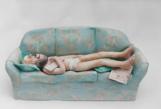 Sleeping Man on Sofa ceramic sculpture by Janet Bajorek