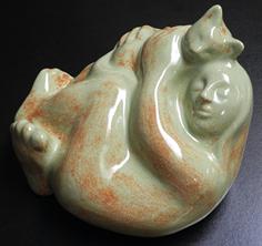 Ceramic sculpture of girl and cat by Janet Fullmer Bajorek