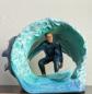 Ceramic Sculpture of Surfer in the tube by Janet Bajorek